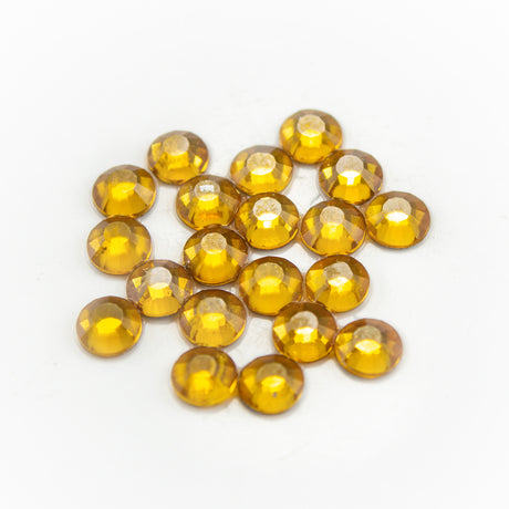 Swarovski дек. кам. 3.91 мм златни /Topaz/- 20 бр L